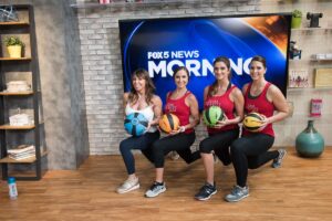 Group of woman pose in lunges with Smart Medicine Balls