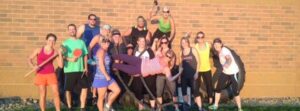 large group poses for a photo post group fitness workout