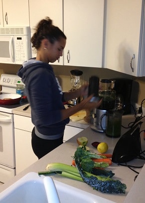 woman in kitchen making smoothie
