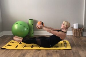 How To Do a V-Up Pulse with Medicine Ball Step 3