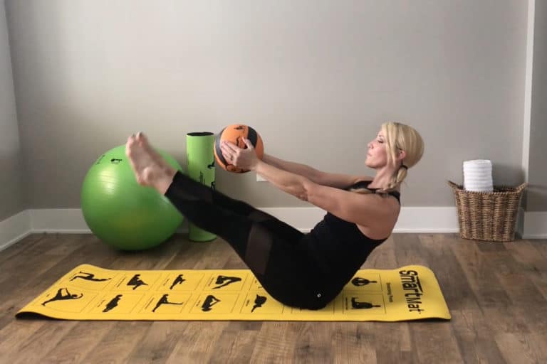How To Do a V-Up Pulse with Medicine Ball–Pilates