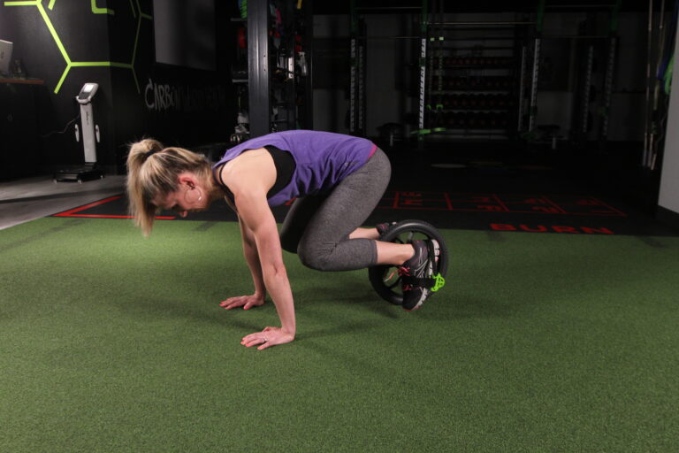 Using A Core Wheel: How to Do Knee Tucks