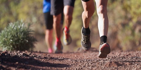 Outdoor cross-country running in summer sunshine concept for exercising, fitness and healthy lifestyle